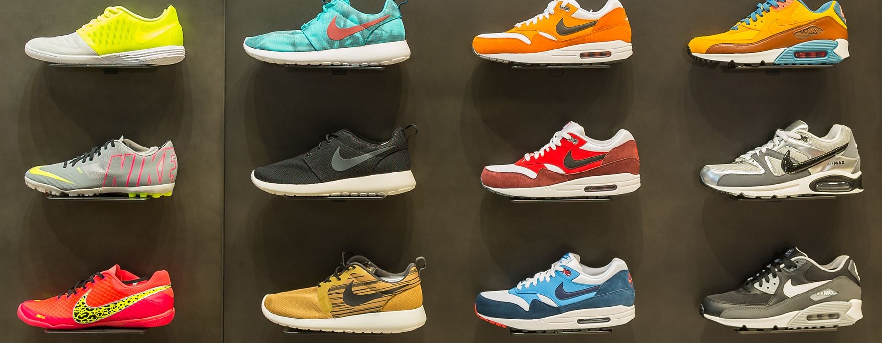 Image of nike trainers neon displayed against a wall
