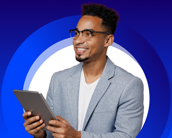 Smiling young man with glasses holding tablet