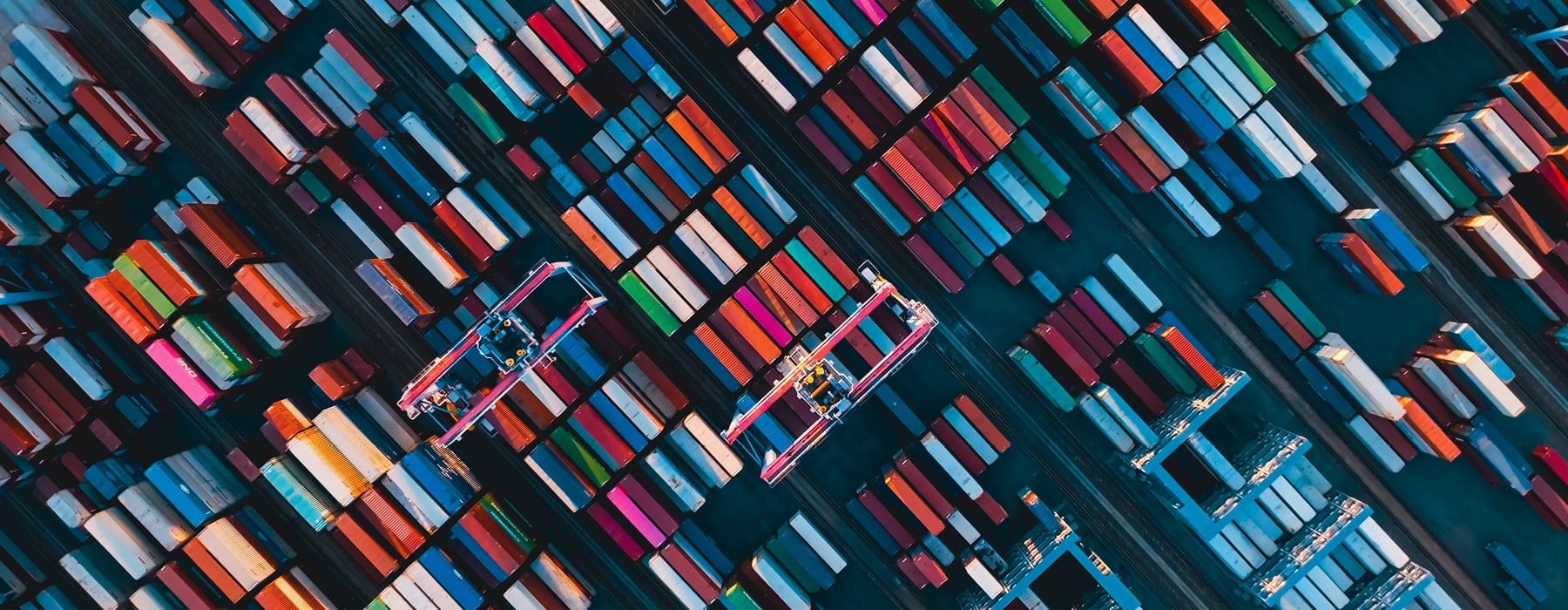 Birds eye view of hundreds of shipping containers of different colours. 
